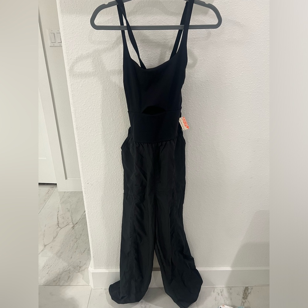 Free People movement righteous onesie. Black size Large NWT